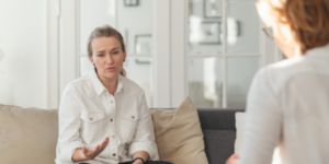 Woman complaining in therapy session