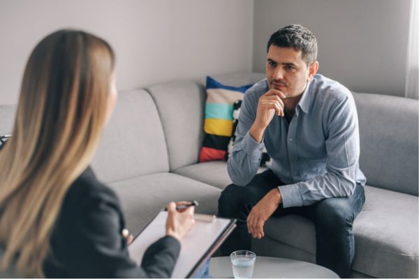 anxious man receiving counseling