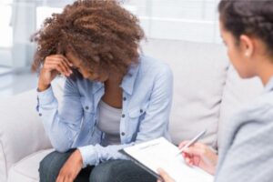 depressed woman receiving mental health treatment