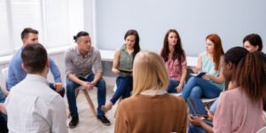 people attending a group therapy session